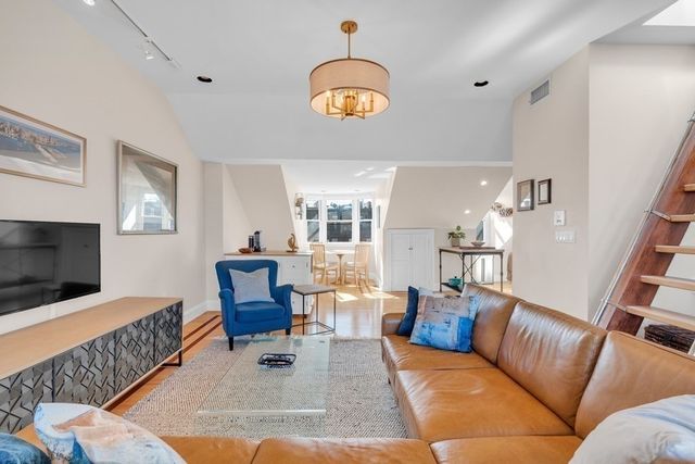 a living room with furniture and a couch