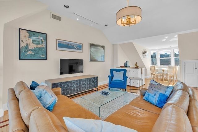 a dining room with furniture and a fireplace