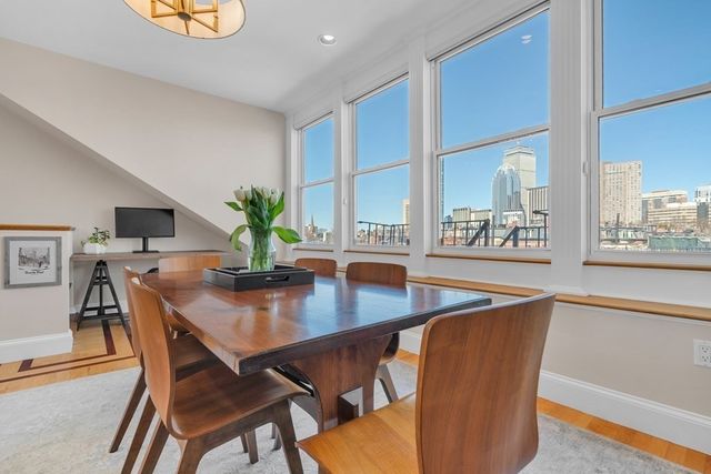 a dining room with furniture and window