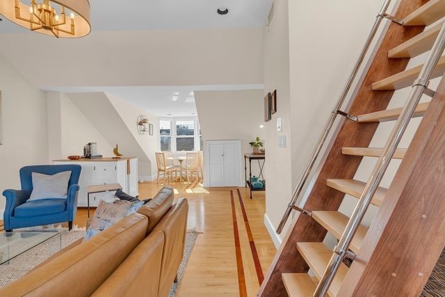 a living room with furniture and a rug