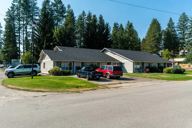 a view of house with outdoor space and street