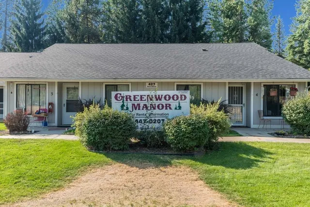 a view of a house with garden and yard