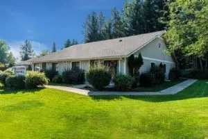 a front view of a house with garden