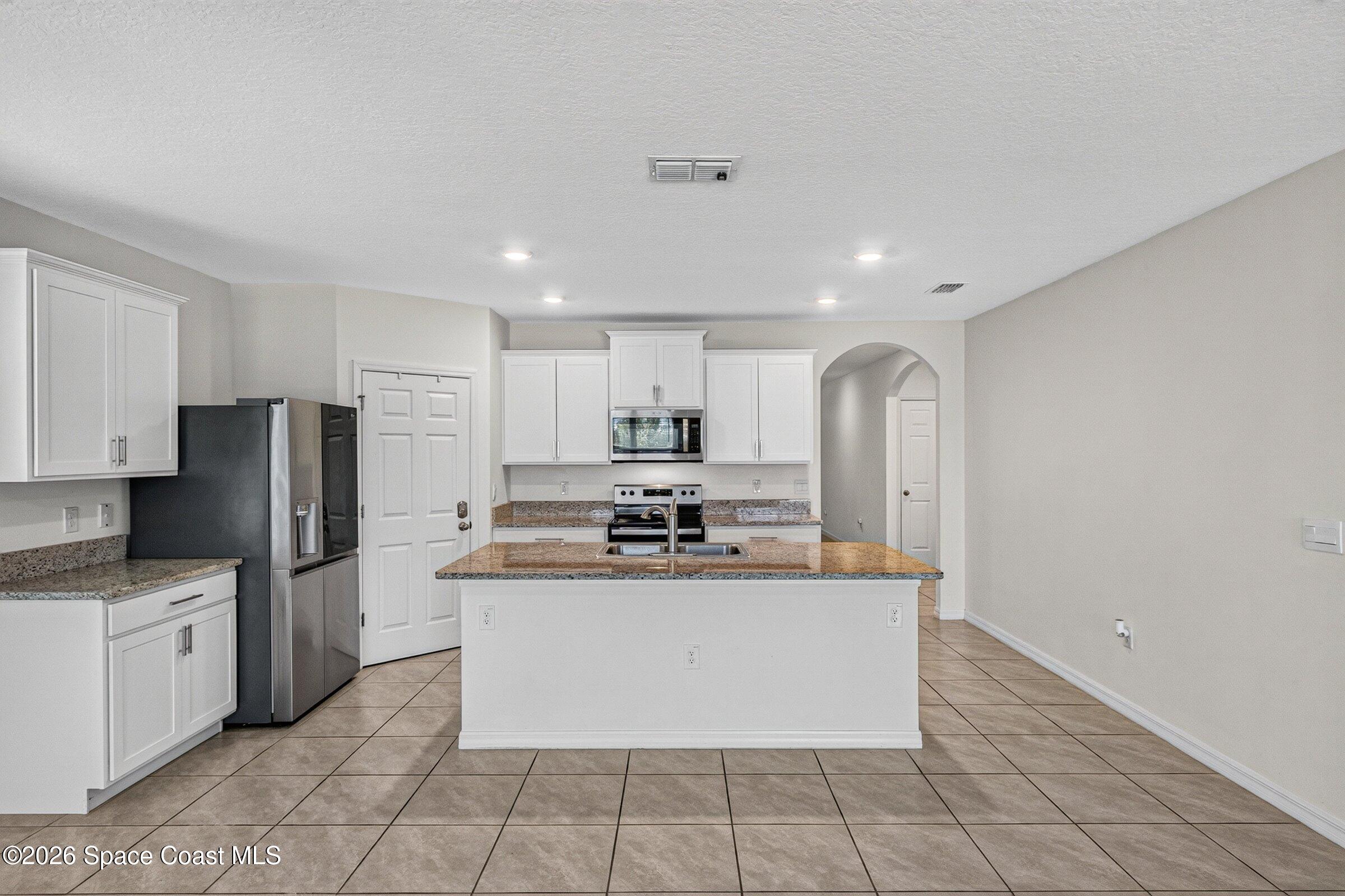 3419 Foggy Mist Road Southeast Palm Bay, FL 32909 - Photo 5 of 39 Spacious Kitchen