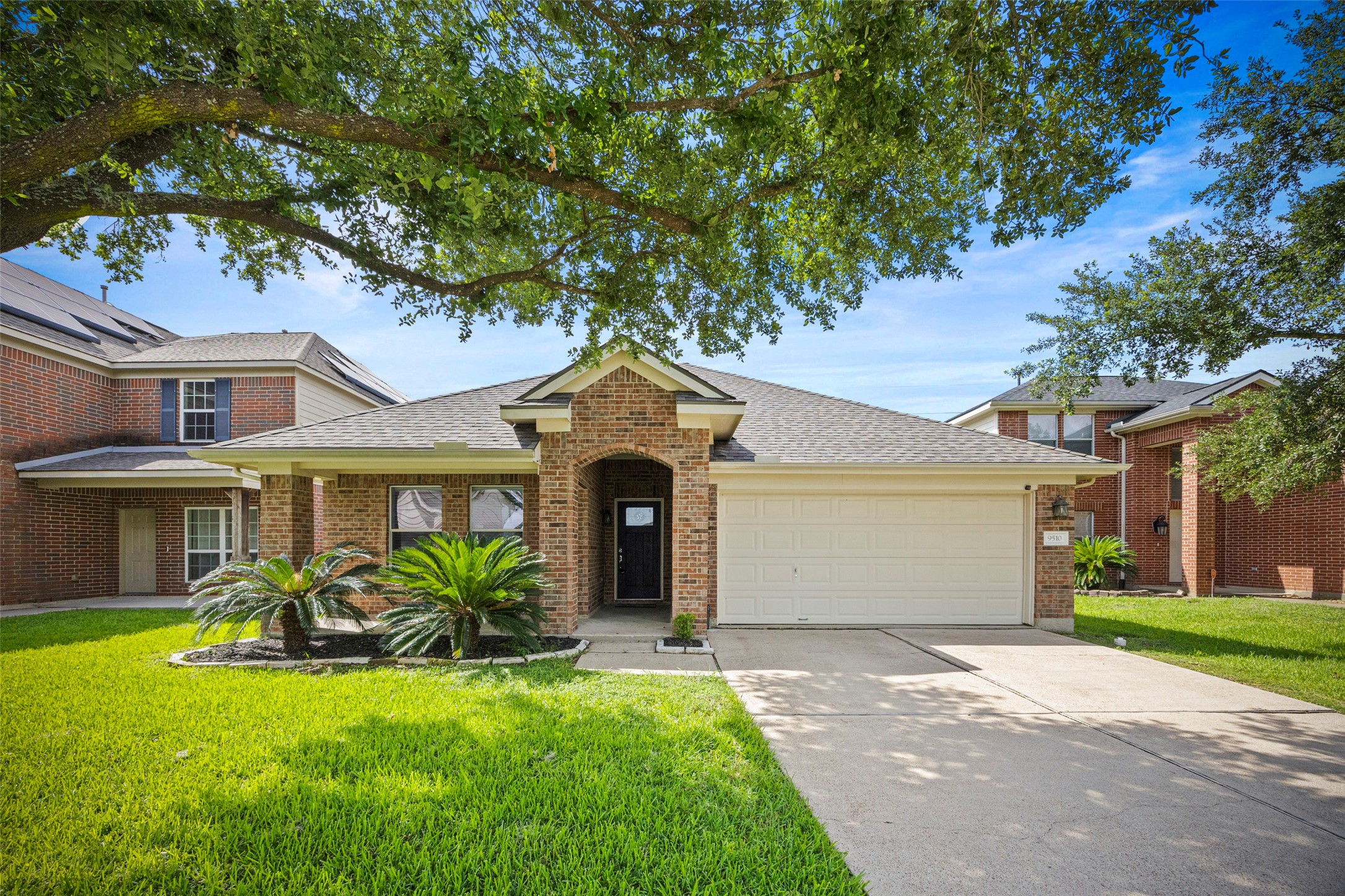 a front view of a house with garden