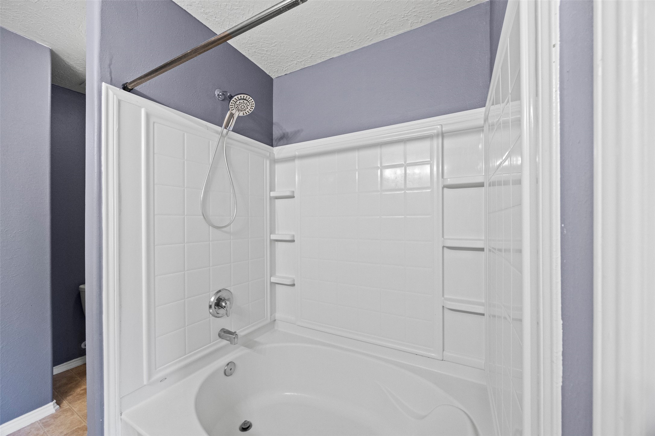 9510 Barr Spring Drive Humble, TX 77396 - Photo 21 of 27 a bathroom with a bathtub and a shower