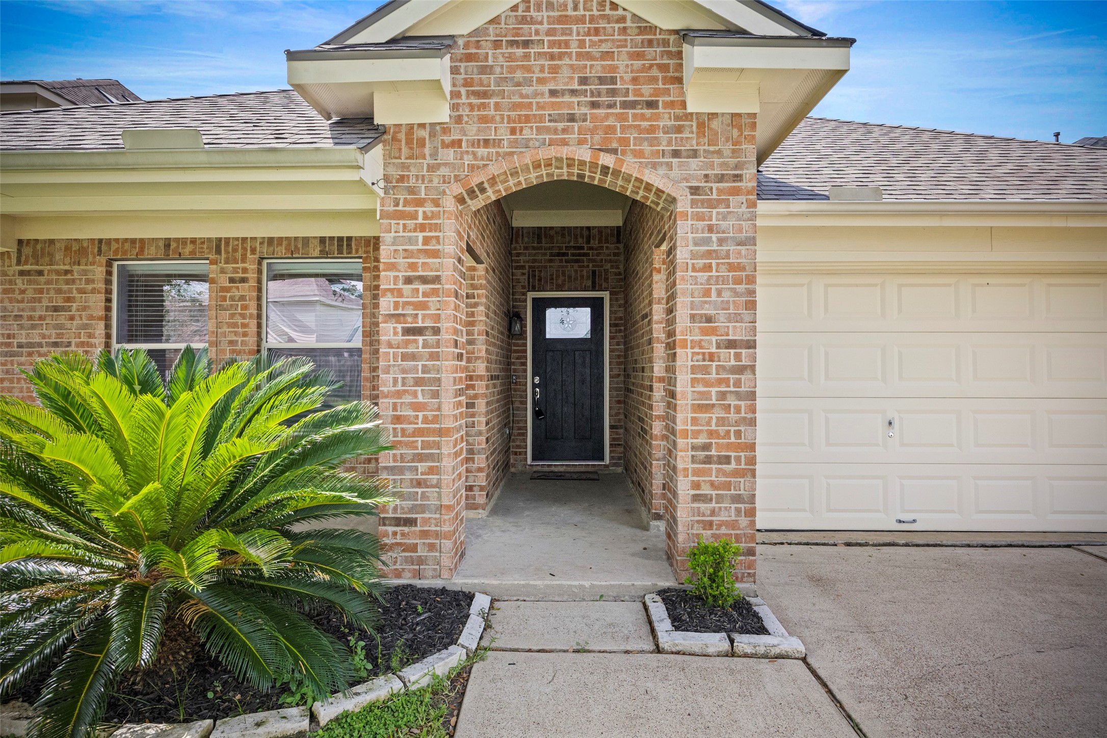9510 Barr Spring Drive Humble, TX 77396 - Photo 4 of 27 a front view of a house with plants