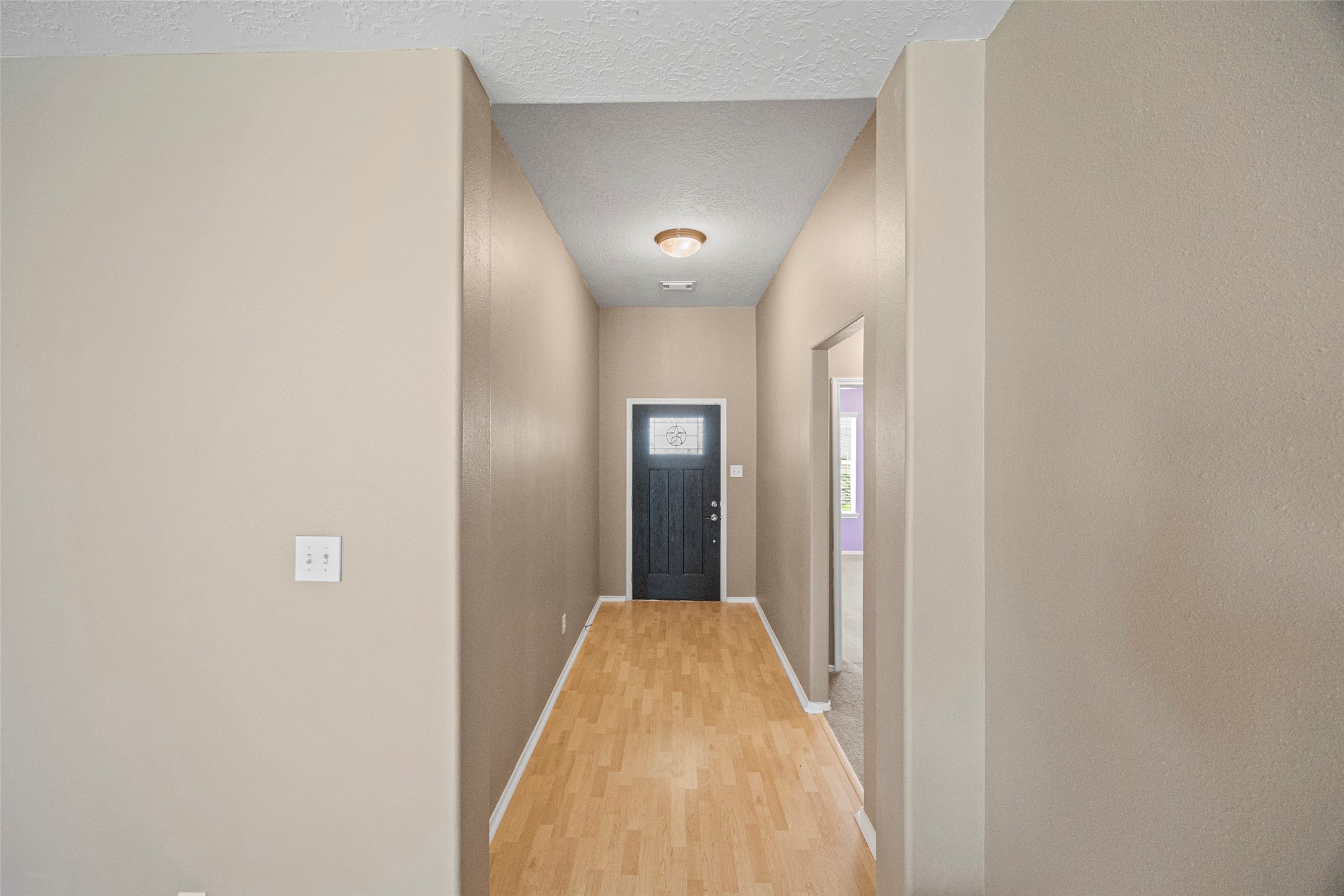 9510 Barr Spring Drive Humble, TX 77396 - Photo 5 of 27 a view of a hallway with wooden floor