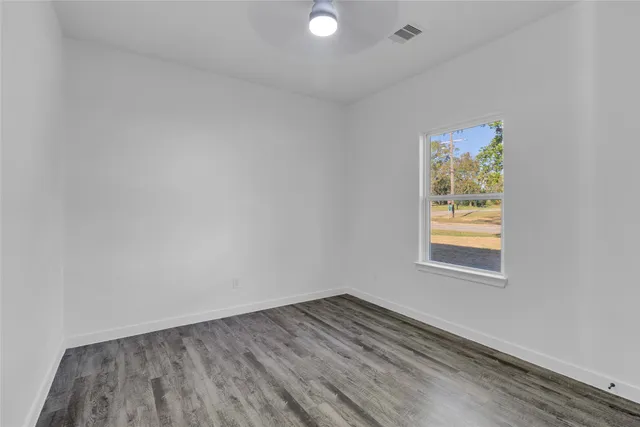 an aerial view of residential house with a yard