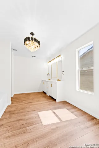 a view of a room with a wooden floor