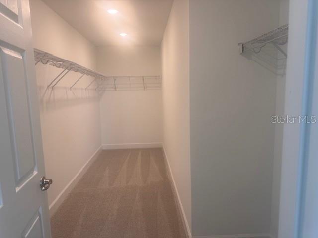 4411 Laurel Site Loop Apopka, FL 32712 - Photo 12 of 14 a view of a room with racks on the wall