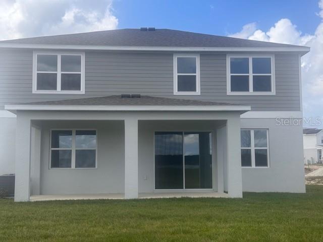 4411 Laurel Site Loop Apopka, FL 32712 - Photo 13 of 14 a front view of a house with a garden