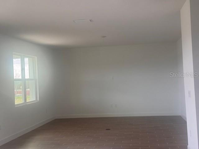 4411 Laurel Site Loop Apopka, FL 32712 - Photo 5 of 14 an empty room with a window