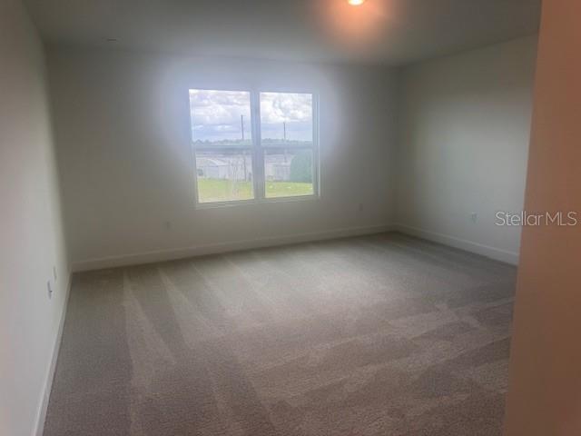 4411 Laurel Site Loop Apopka, FL 32712 - Photo 9 of 14 an empty room with a window