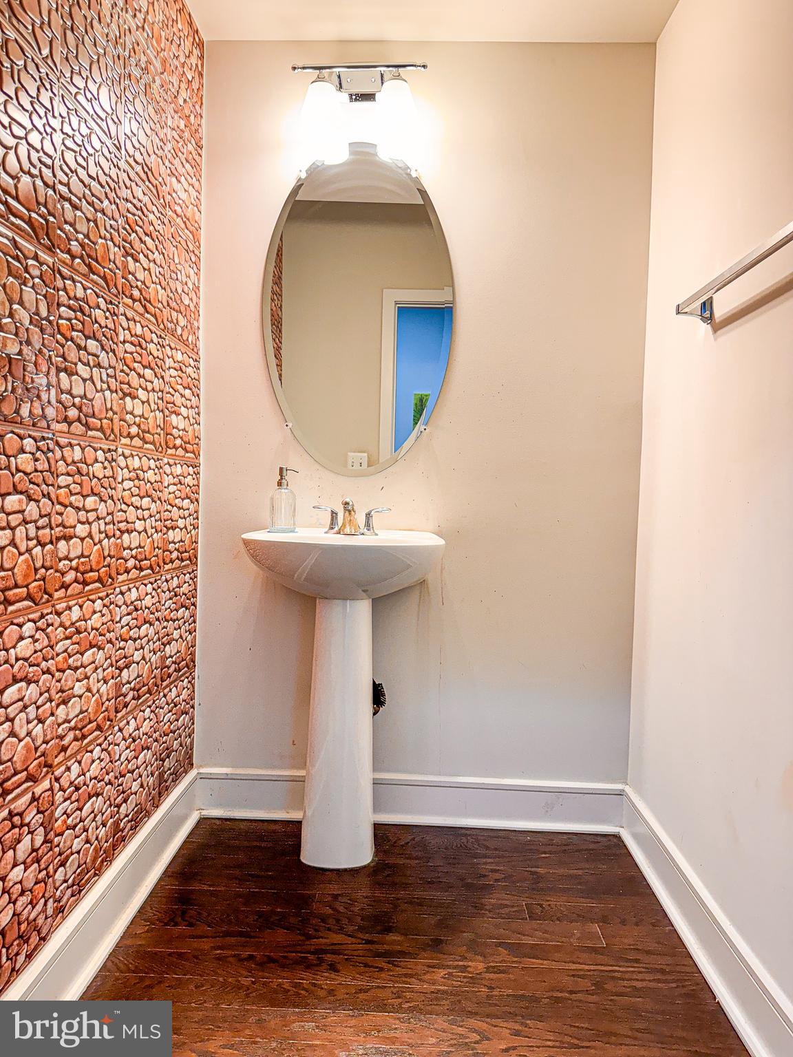 25419 Reed Orchard Terrace Chantilly, VA 20152 - Photo 17 of 47 a view of a room with wooden floor and mirror
