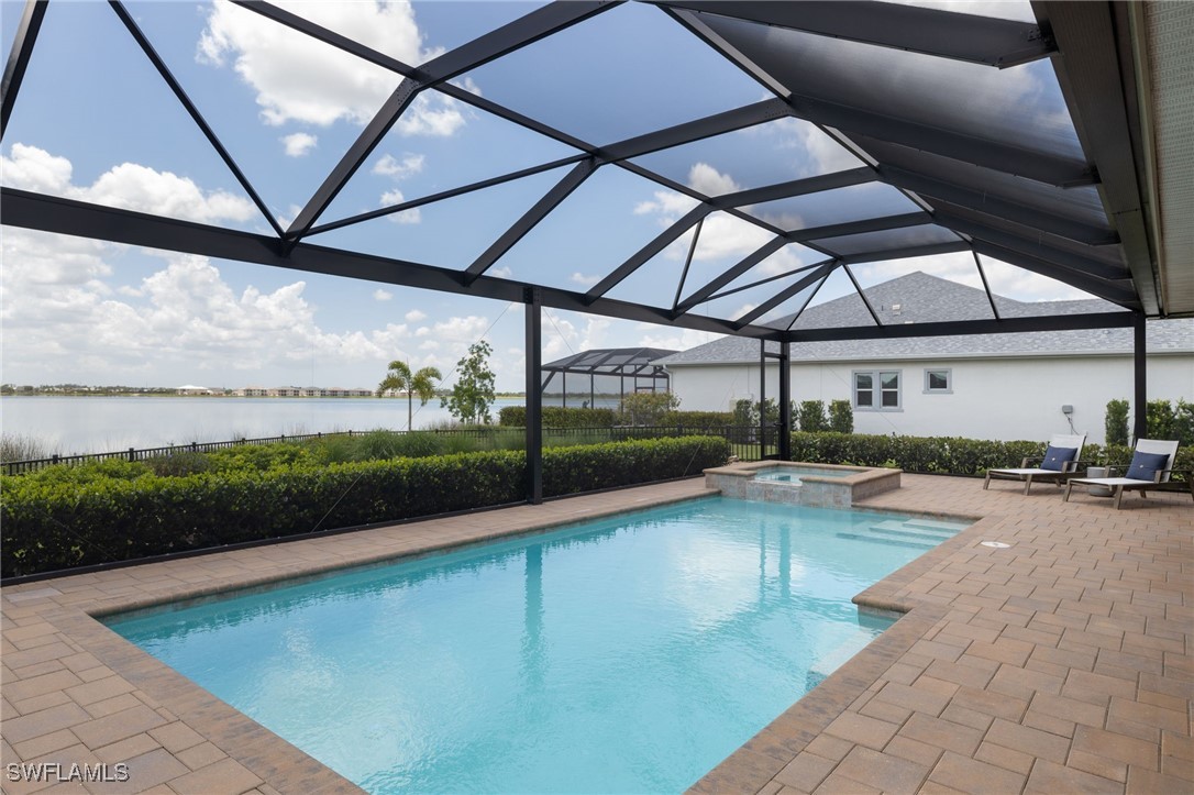 43466 Waterside Trail Punta Gorda, FL 33982 - Photo 14 of 32 a view of a swimming pool with a patio