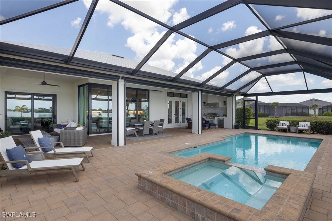 43466 Waterside Trail Punta Gorda, FL 33982 - Photo 15 of 32 a view of a patio with swimming pool table and chairs