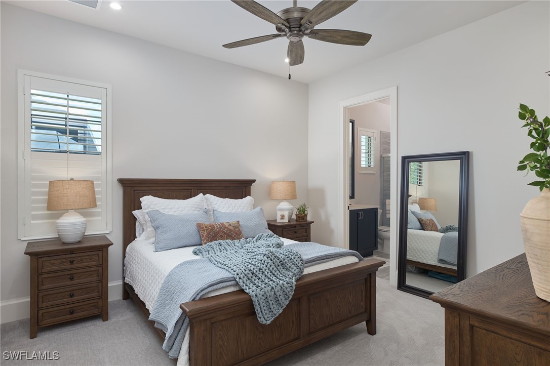 43466 Waterside Trail Punta Gorda, FL 33982 - Photo 22 of 32 a bedroom with a bed and wooden floor
