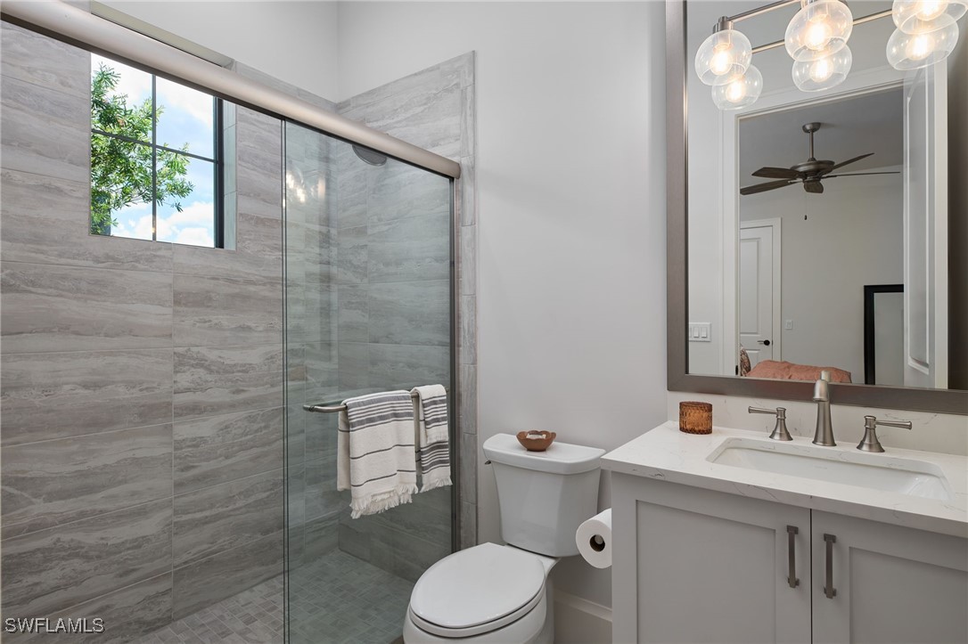 43466 Waterside Trail Punta Gorda, FL 33982 - Photo 23 of 32 a bathroom with a sink a toilet and shower