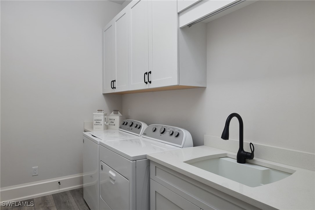 43466 Waterside Trail Punta Gorda, FL 33982 - Photo 24 of 32 a close view of a sink and cabinets in the wall