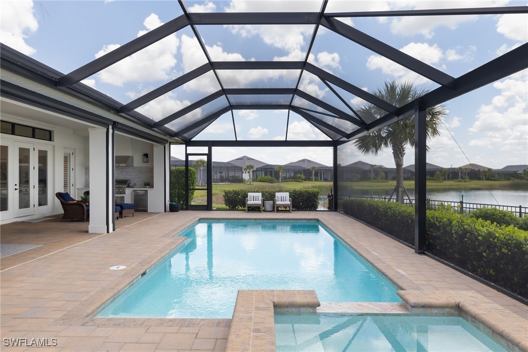 43466 Waterside Trail Punta Gorda, FL 33982 - Photo 26 of 32 a view of a swimming pool with a patio