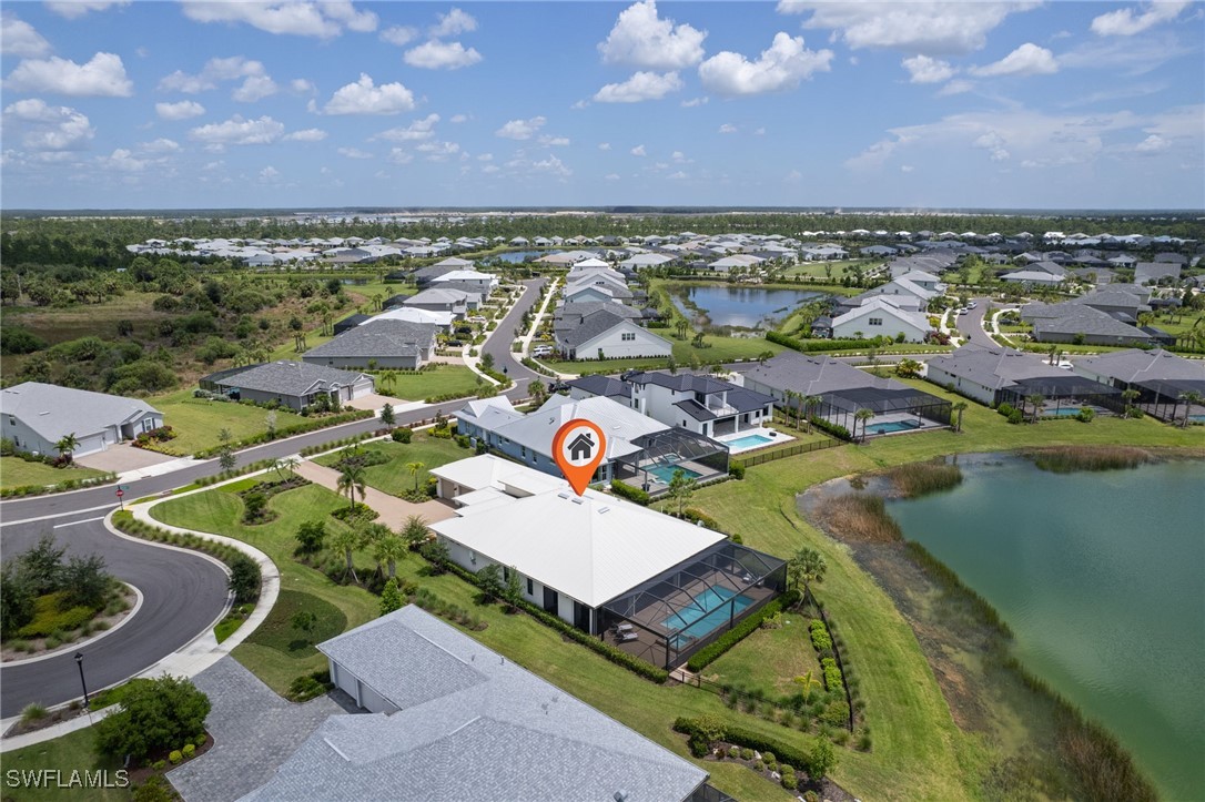 43466 Waterside Trail Punta Gorda, FL 33982 - Photo 30 of 32 an aerial view of residential houses with outdoor space