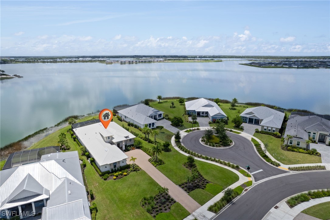 43466 Waterside Trail Punta Gorda, FL 33982 - Photo 31 of 32 a aerial view of a house with swimming pool and outdoor seating