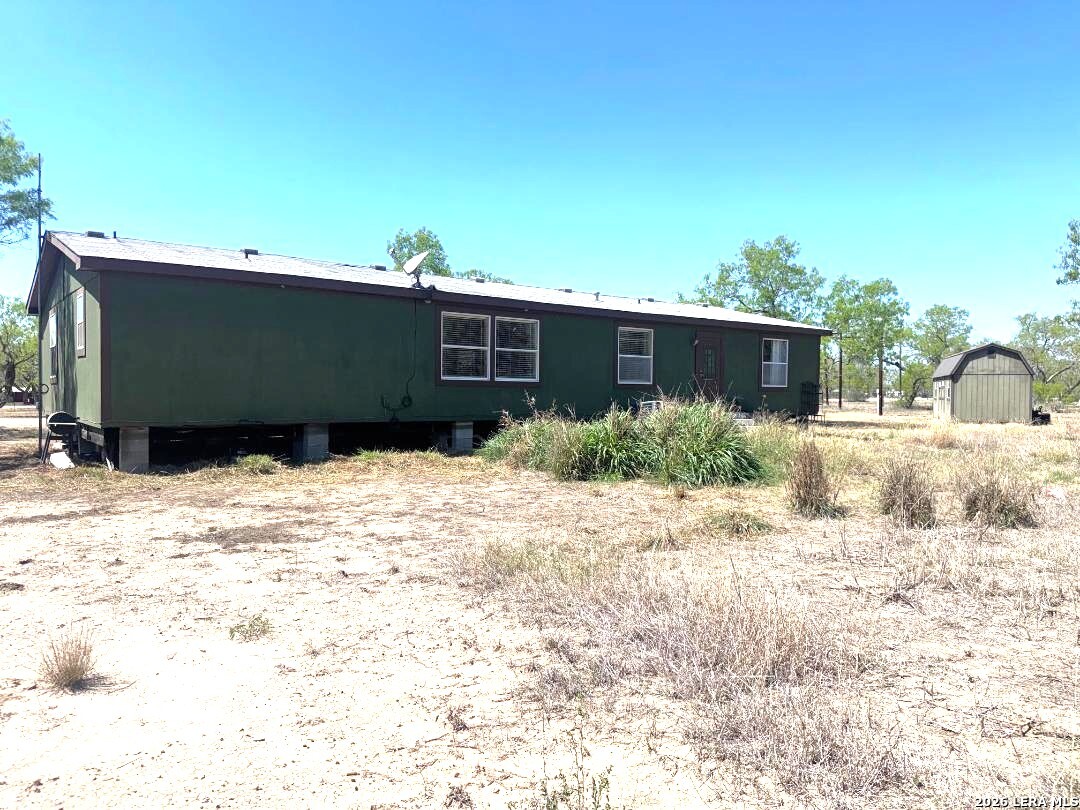 435 N Trail Pleasanton, TX 78064 - Photo 17 of 19 a view of a backyard of the house