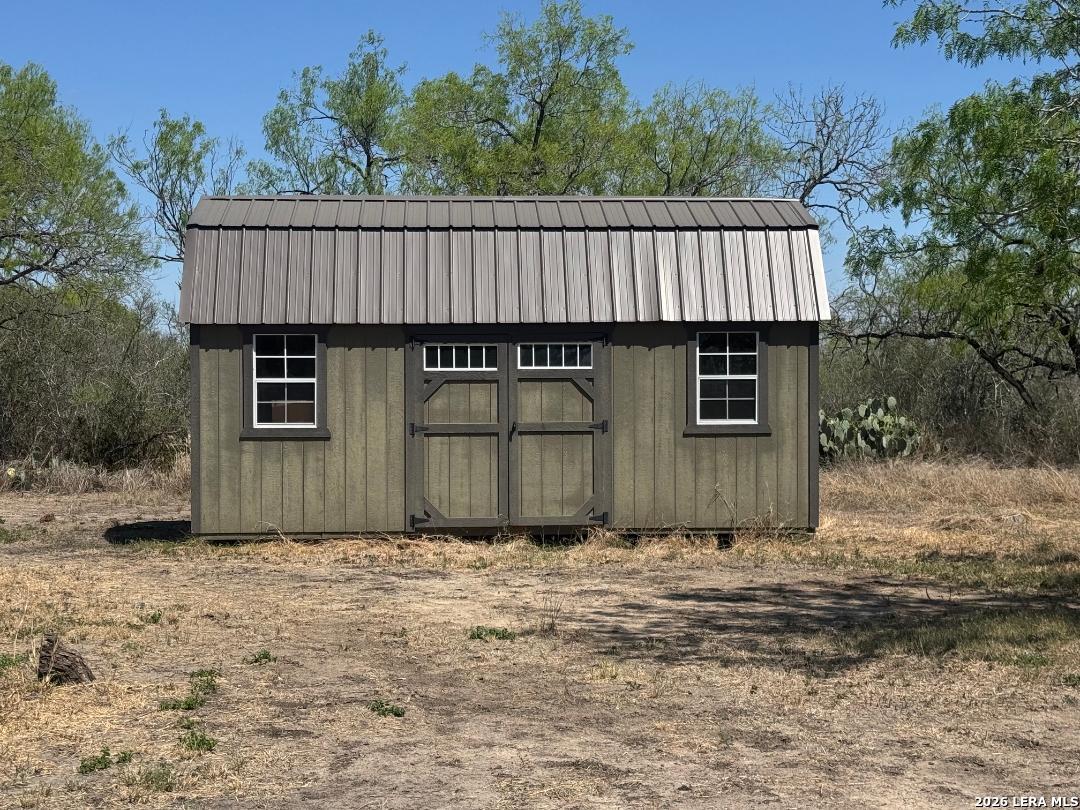 435 N Trail Pleasanton, TX 78064 - Photo 2 of 19 a front view of a house with a yard
