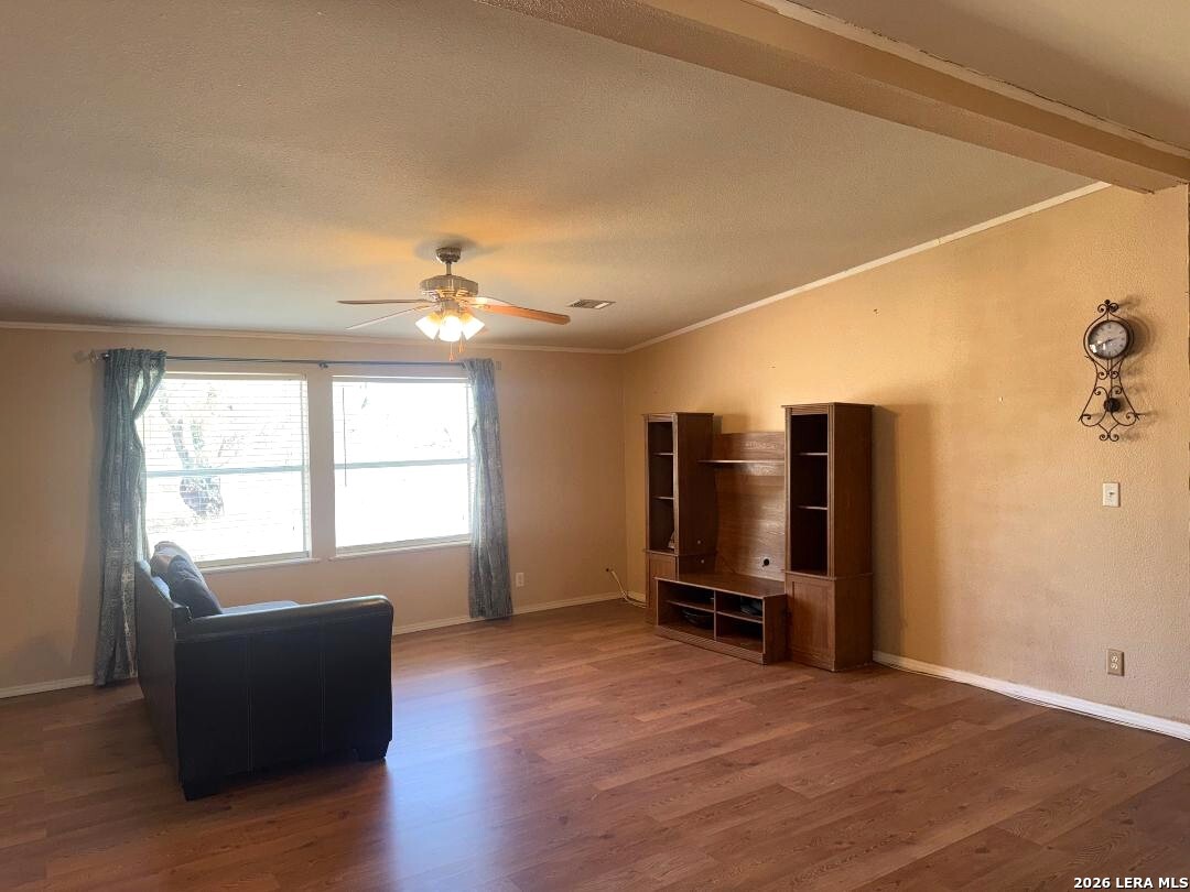 435 N Trail Pleasanton, TX 78064 - Photo 4 of 19 a view of a livingroom with furniture and wooden floor