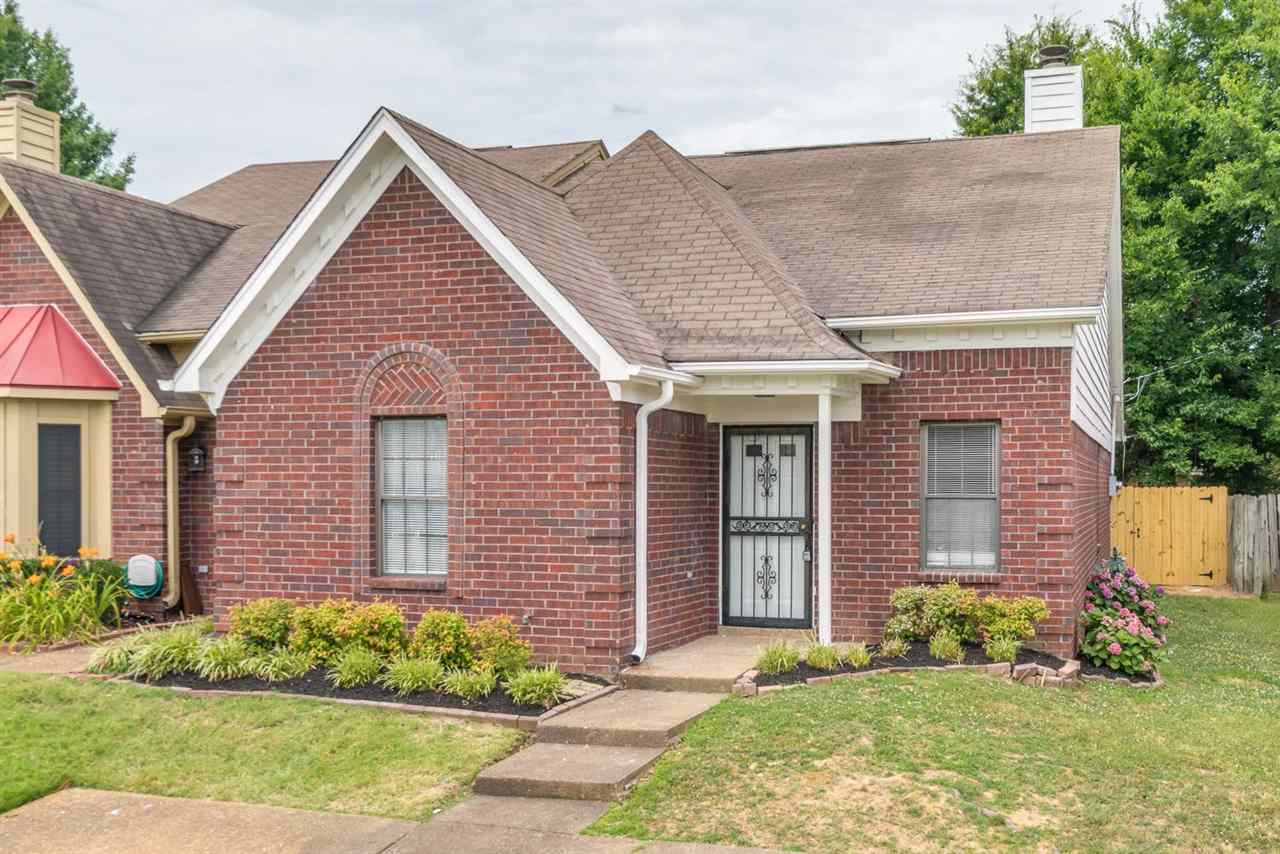 4233 Meadow Ridge Trail Memphis, TN 38141 - Photo 1 of 21 a front view of a house with garden