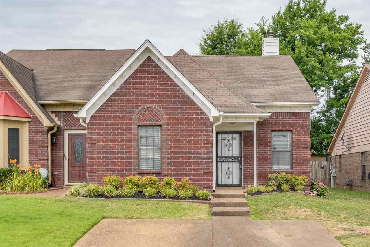 4233 Meadow Ridge Trail Memphis, TN 38141 - Photo 2 of 21 a front view of a house with garden