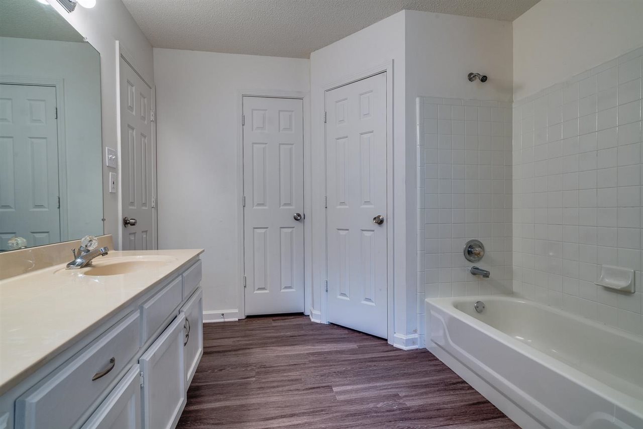 4233 Meadow Ridge Trail Memphis, TN 38141 - Photo 15 of 21 a spacious bathroom with a tub sink and mirror