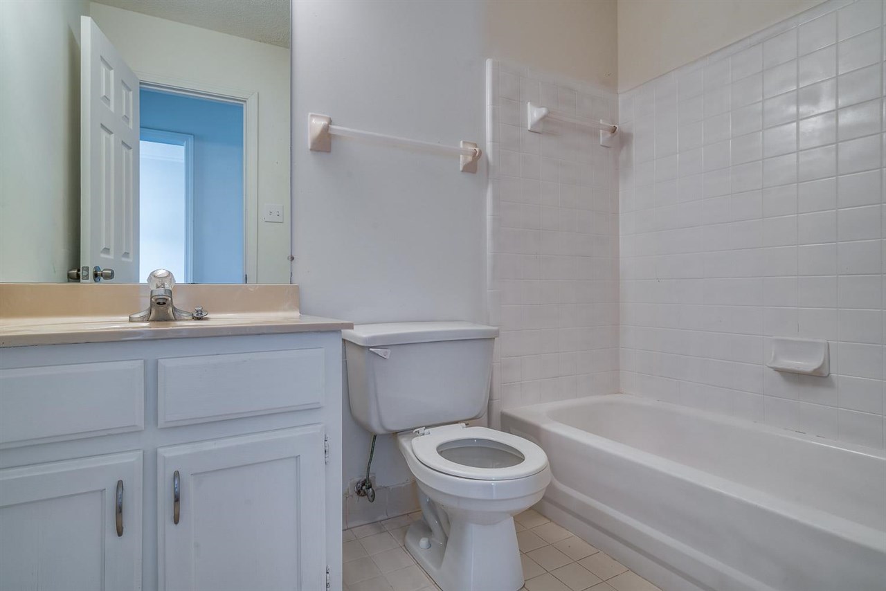 4233 Meadow Ridge Trail Memphis, TN 38141 - Photo 18 of 21 a bathroom with a sink a toilet and shower
