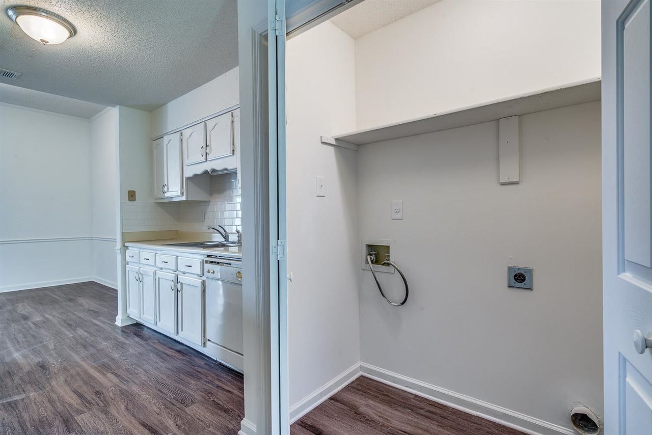 4233 Meadow Ridge Trail Memphis, TN 38141 - Photo 19 of 21 a room with white cabinets and entryway
