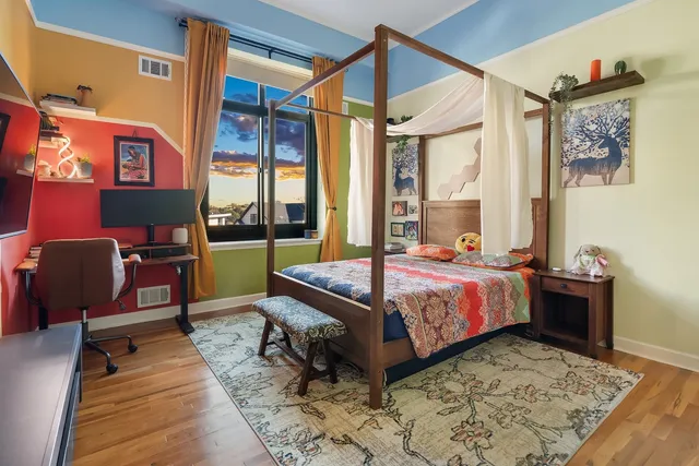 a bedroom with a bed and a window