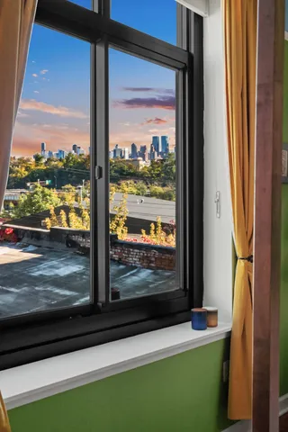 a bed room with a bed and a chair