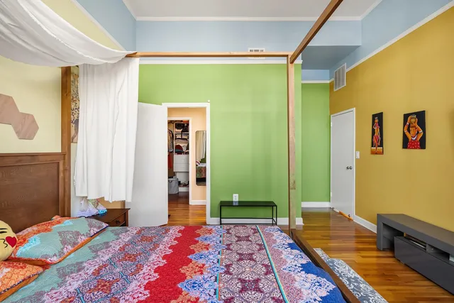 a bathroom with a double vanity sink a toilet and shower