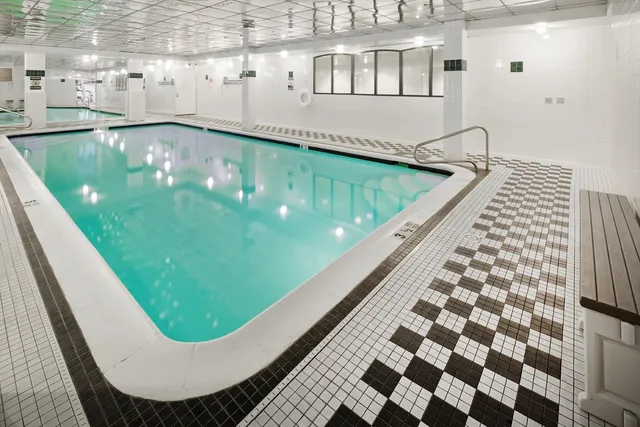 a view of a hallway with wooden shelves