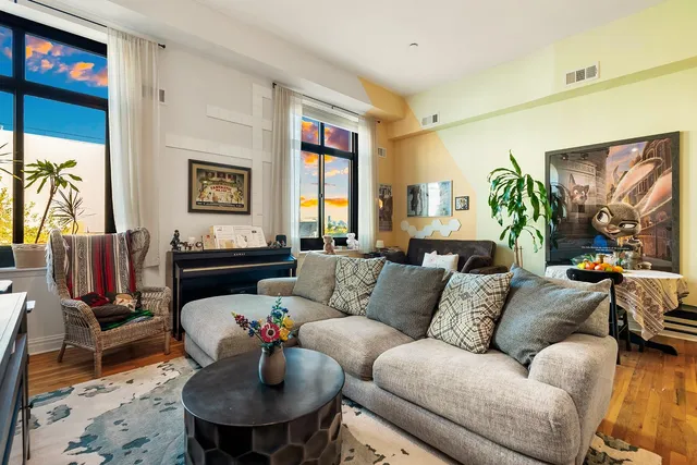 a kitchen with stainless steel appliances granite countertop a stove and cabinets