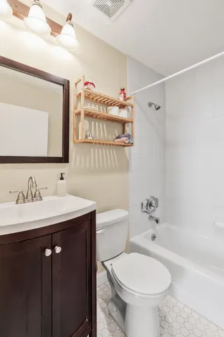 a bed room with a bed and a window