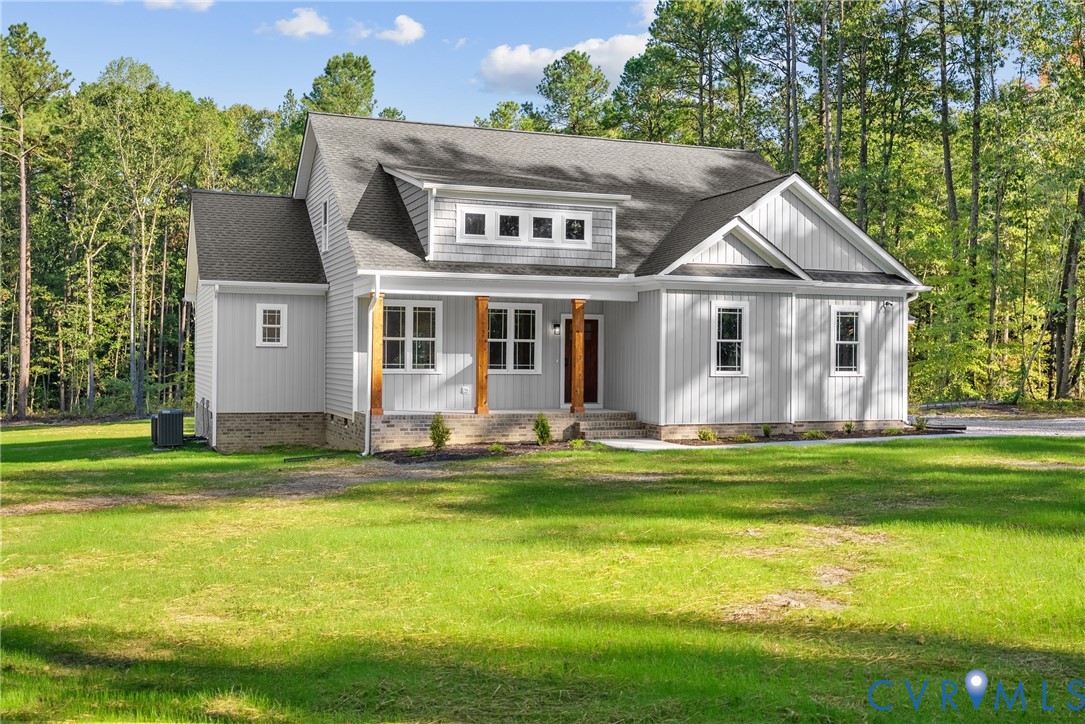 19106 Carson Road Dinwiddie, VA 23841 - Photo 1 of 34 Light gray siding exterior with stone foundation