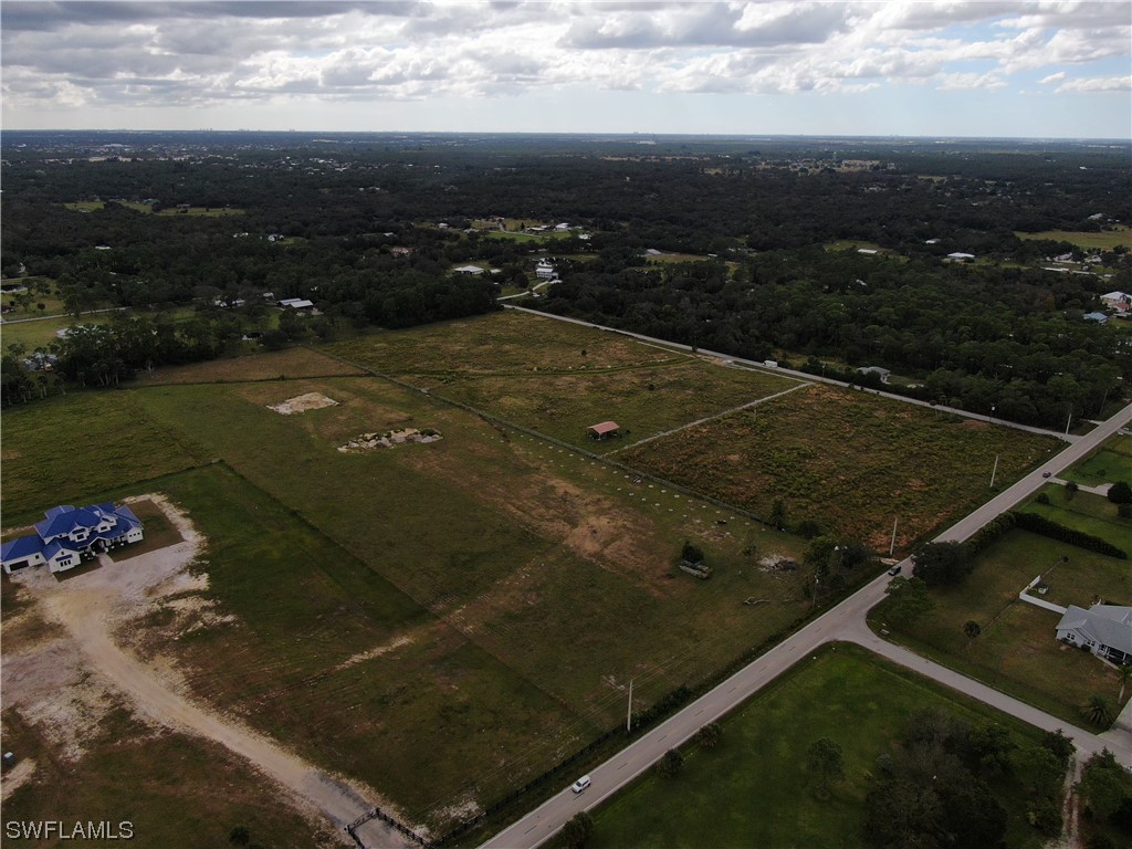 14894 Cemetery Road Fort Myers, FL 33905 - Photo 4 of 7 an aerial view of residential houses with outdoor space