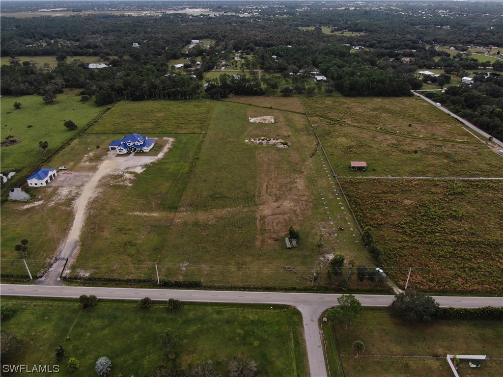 14894 Cemetery Road Fort Myers, FL 33905 - Photo 6 of 7 an aerial view of residential houses with outdoor space