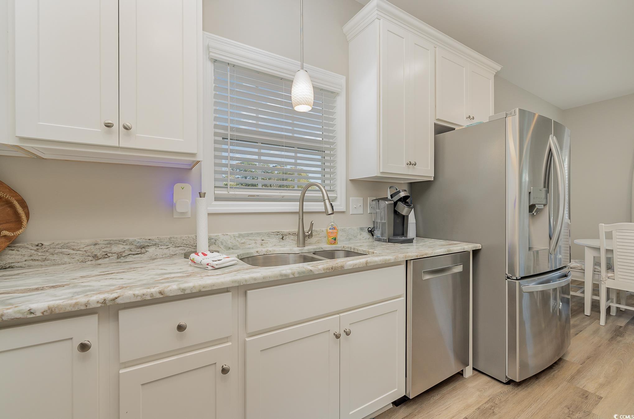 618 Surfside Drive Surfside Beach, SC 29575 - Photo 12 of 40 Kitchen featuring white cabinetry, stainless steel