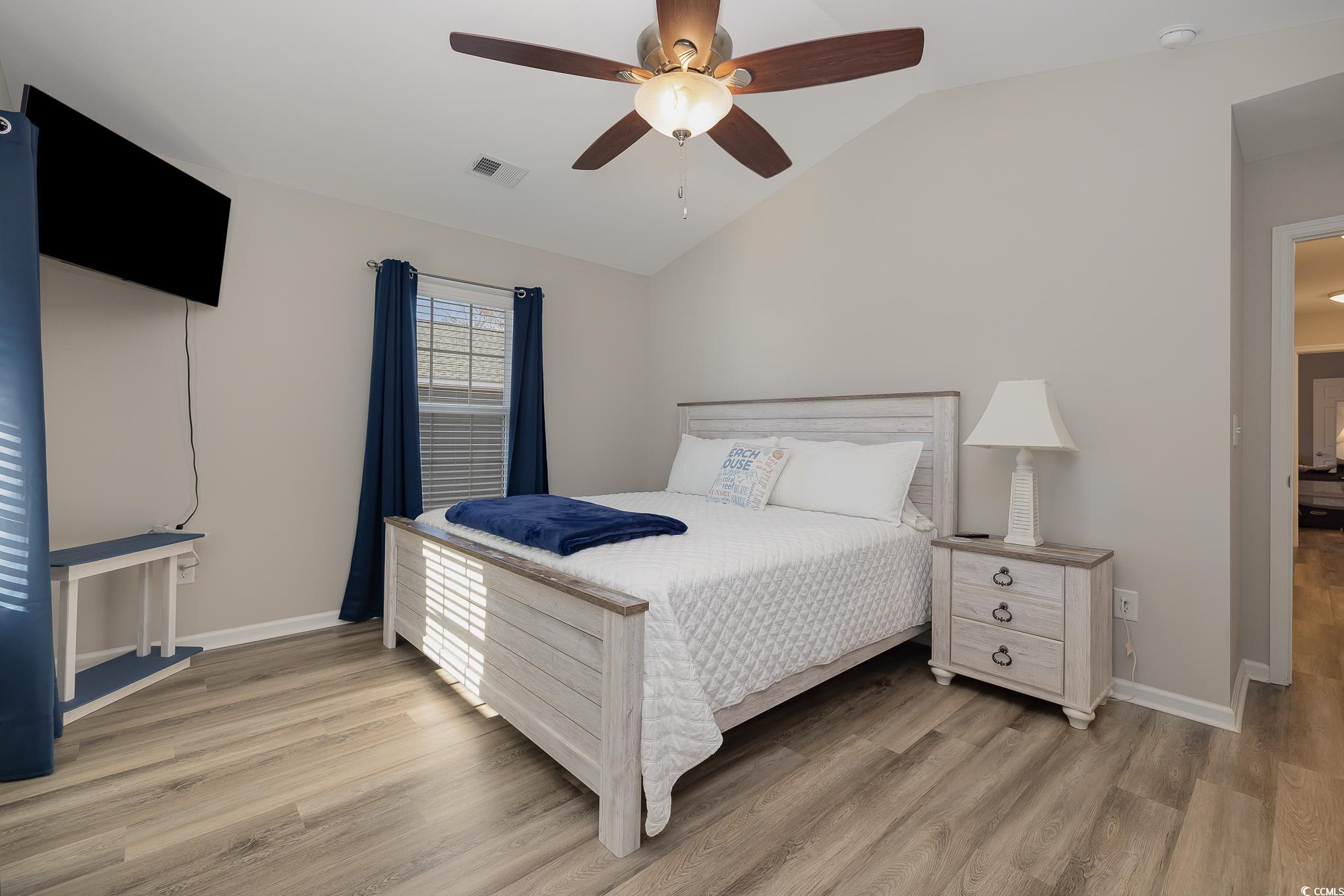 618 Surfside Drive Surfside Beach, SC 29575 - Photo 23 of 40 Bedroom featuring wood-type flooring, vaulted ceil