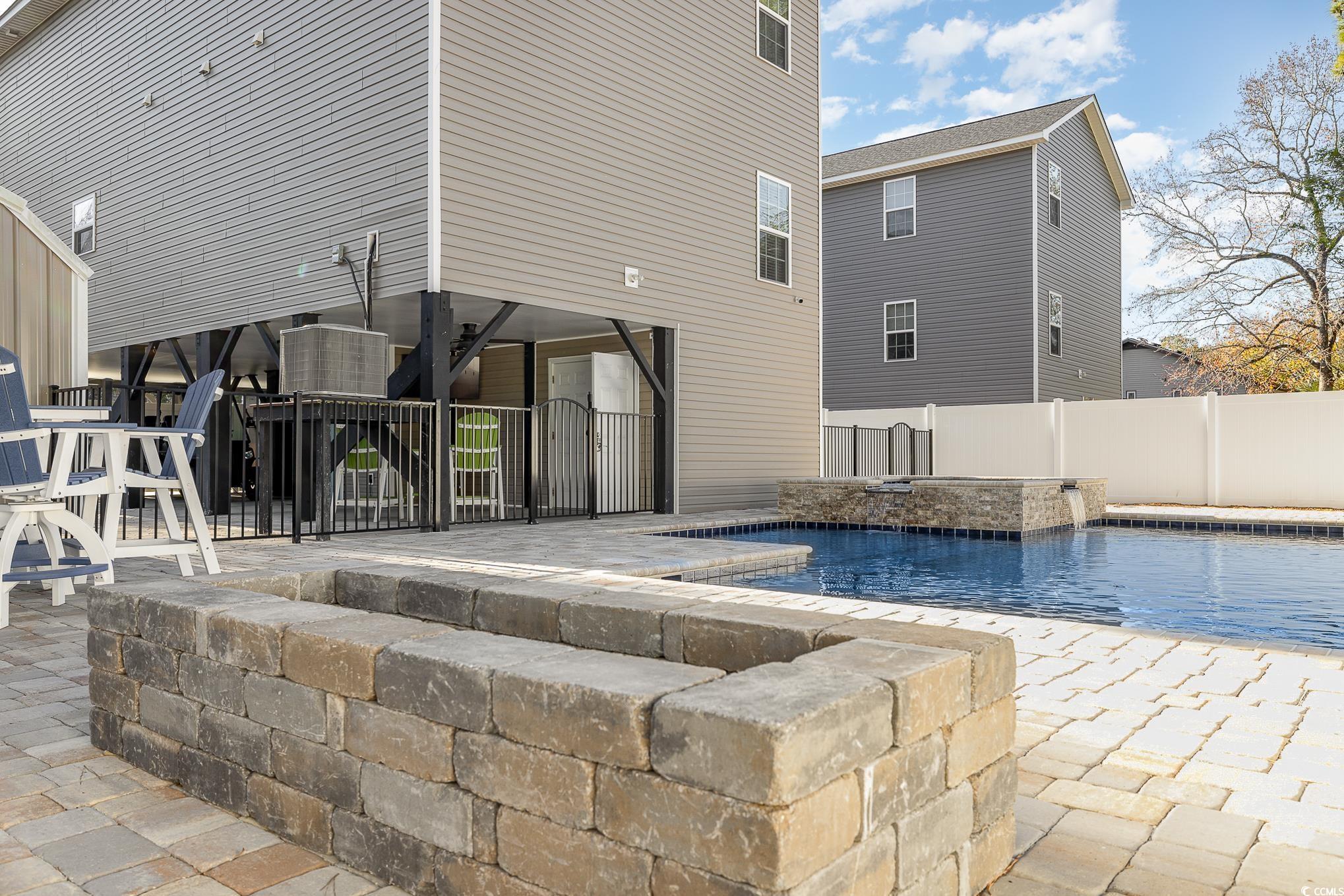 618 Surfside Drive Surfside Beach, SC 29575 - Photo 29 of 40 View of pool with pool water feature and a patio a
