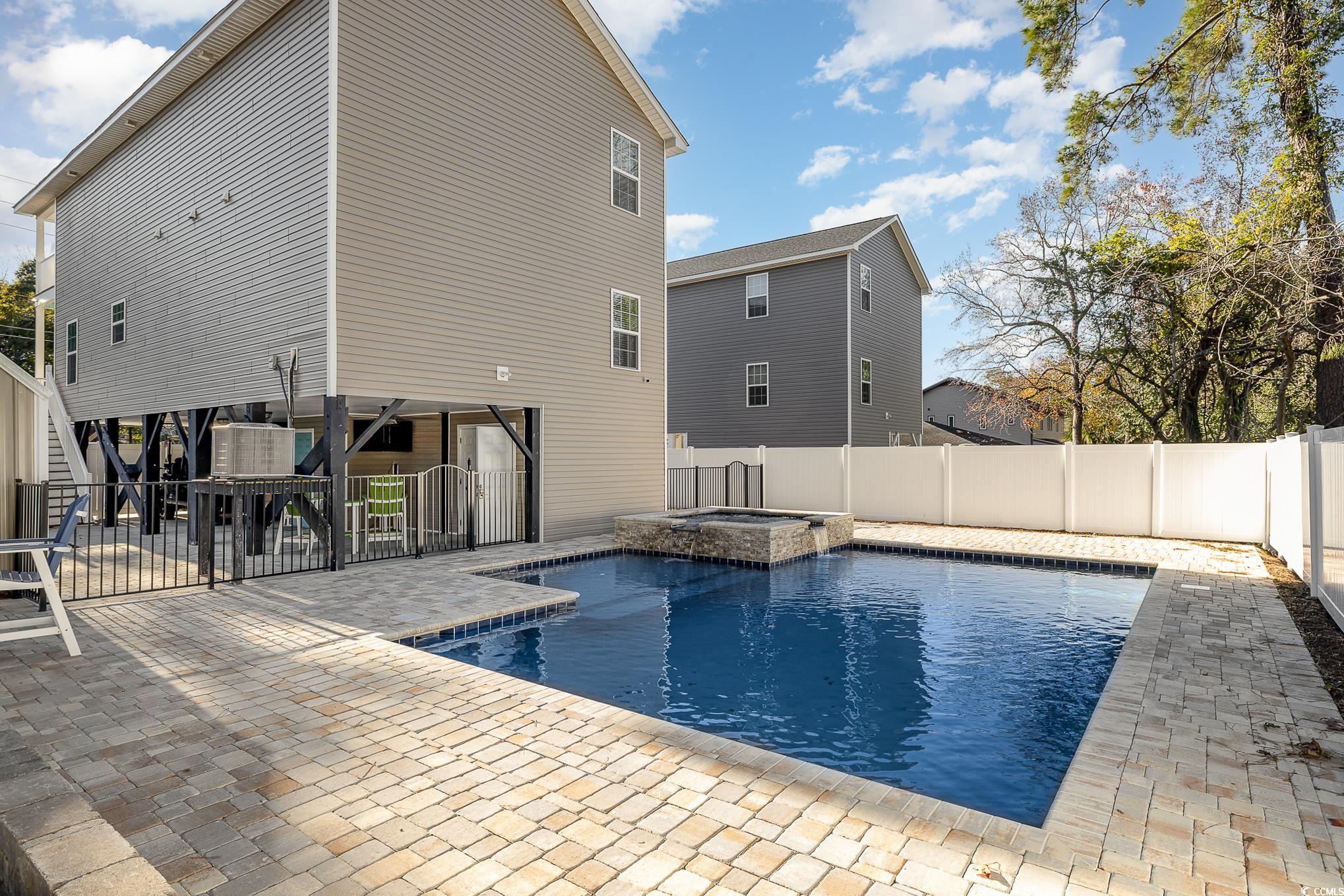 618 Surfside Drive Surfside Beach, SC 29575 - Photo 30 of 40 View of pool with an in ground hot tub and a patio