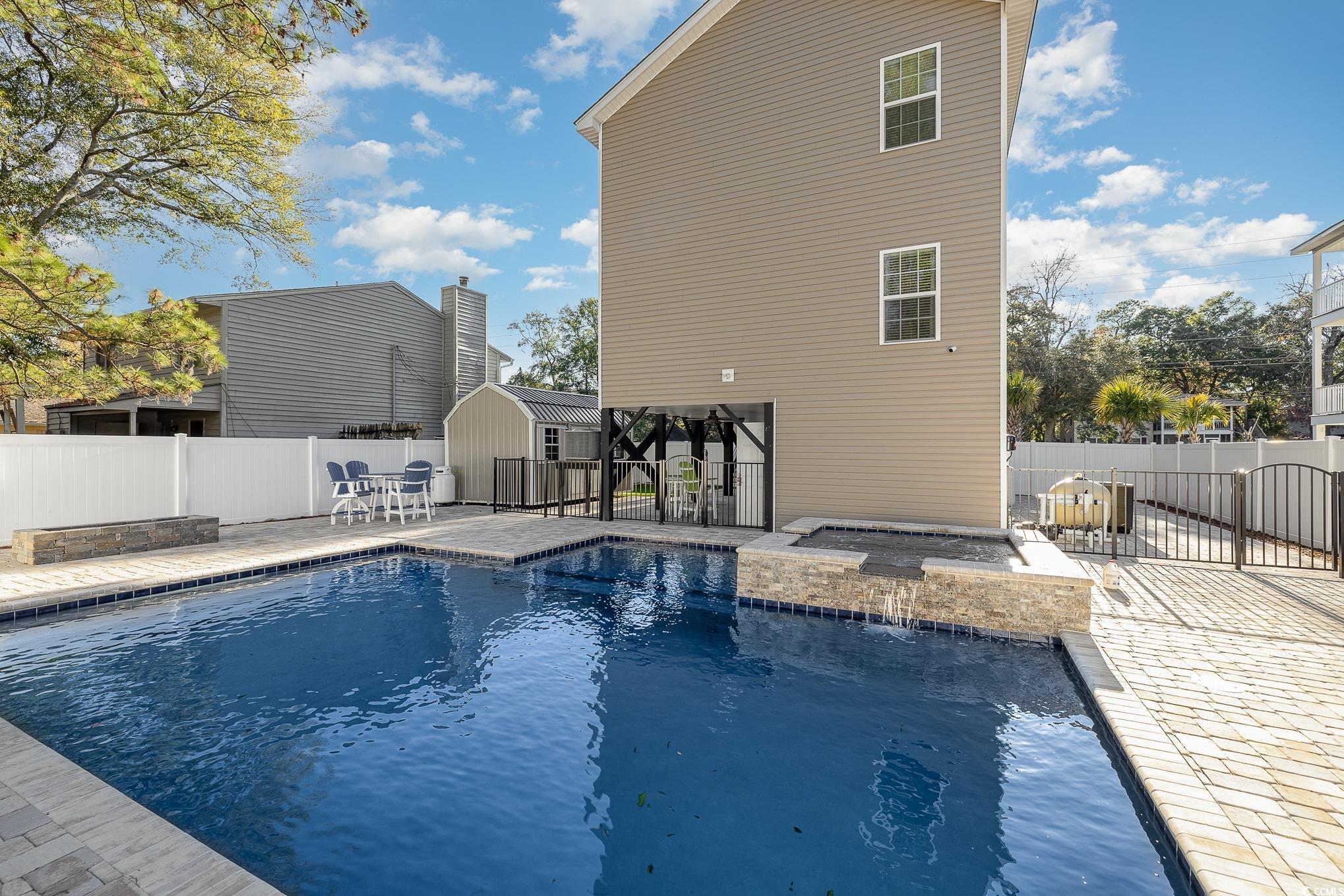 618 Surfside Drive Surfside Beach, SC 29575 - Photo 31 of 40 View of swimming pool featuring a patio and an out