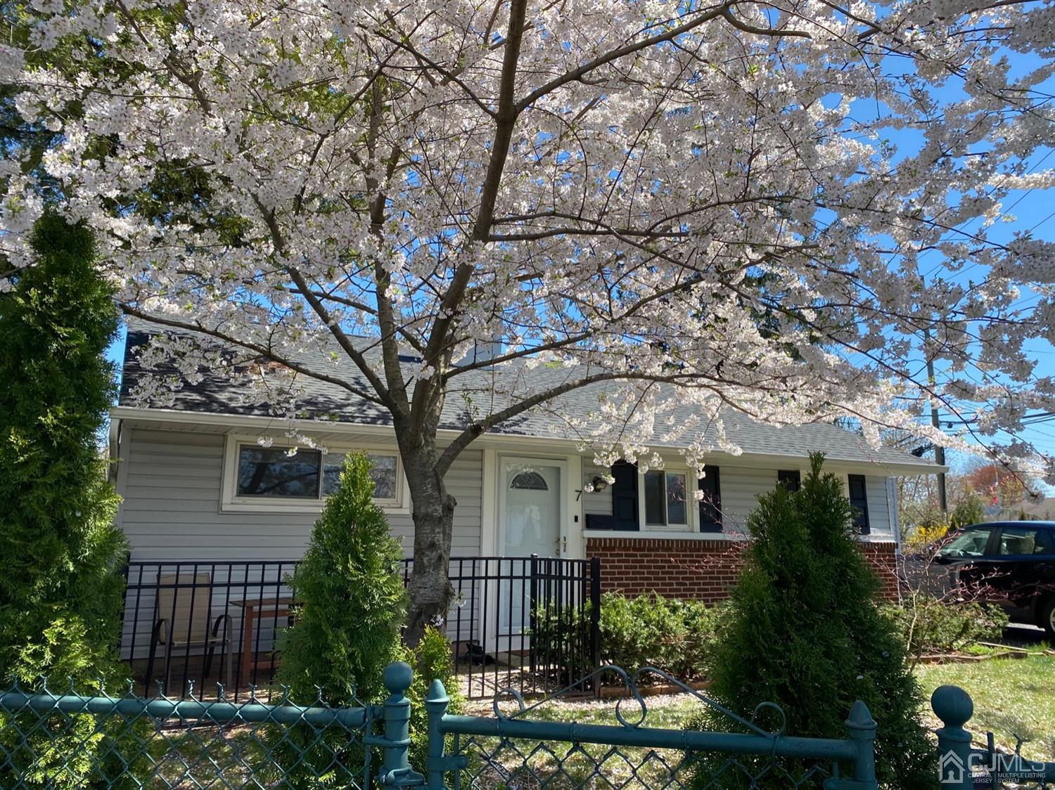 7 Colton Road Edison, NJ 08817 - Photo 1 of 9 a front view of a house with a tree